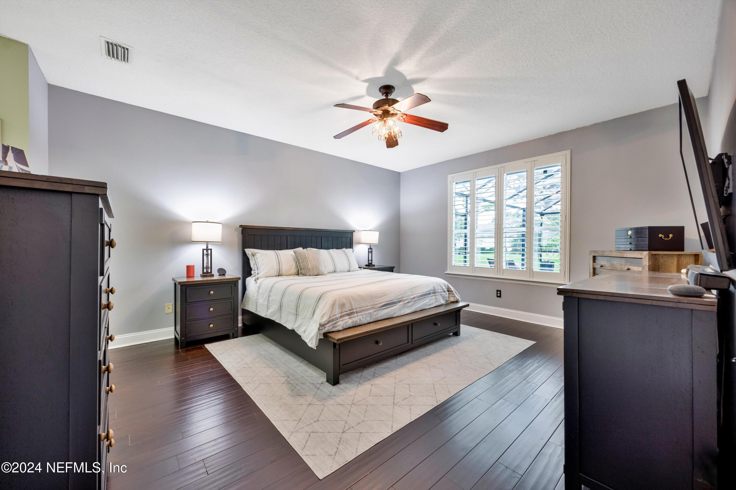 1843 South Landguard Road St. Augustine, FL 32092 - Photo 17 of 67 a bedroom with a large bed and a window
