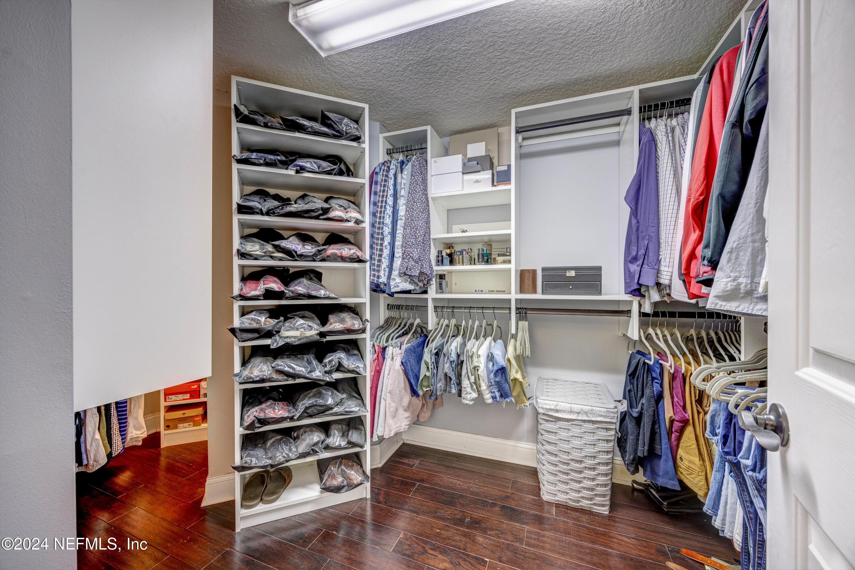1843 South Landguard Road St. Augustine, FL 32092 - Photo 21 of 67 a view of walk in closet with clothes and shoes