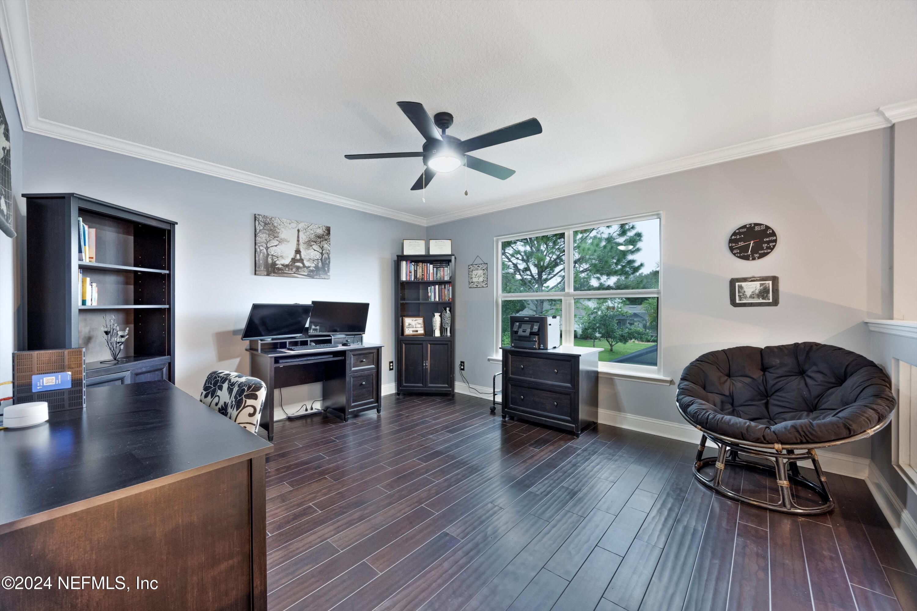 1843 South Landguard Road St. Augustine, FL 32092 - Photo 24 of 67 a living room with furniture and a wooden floor