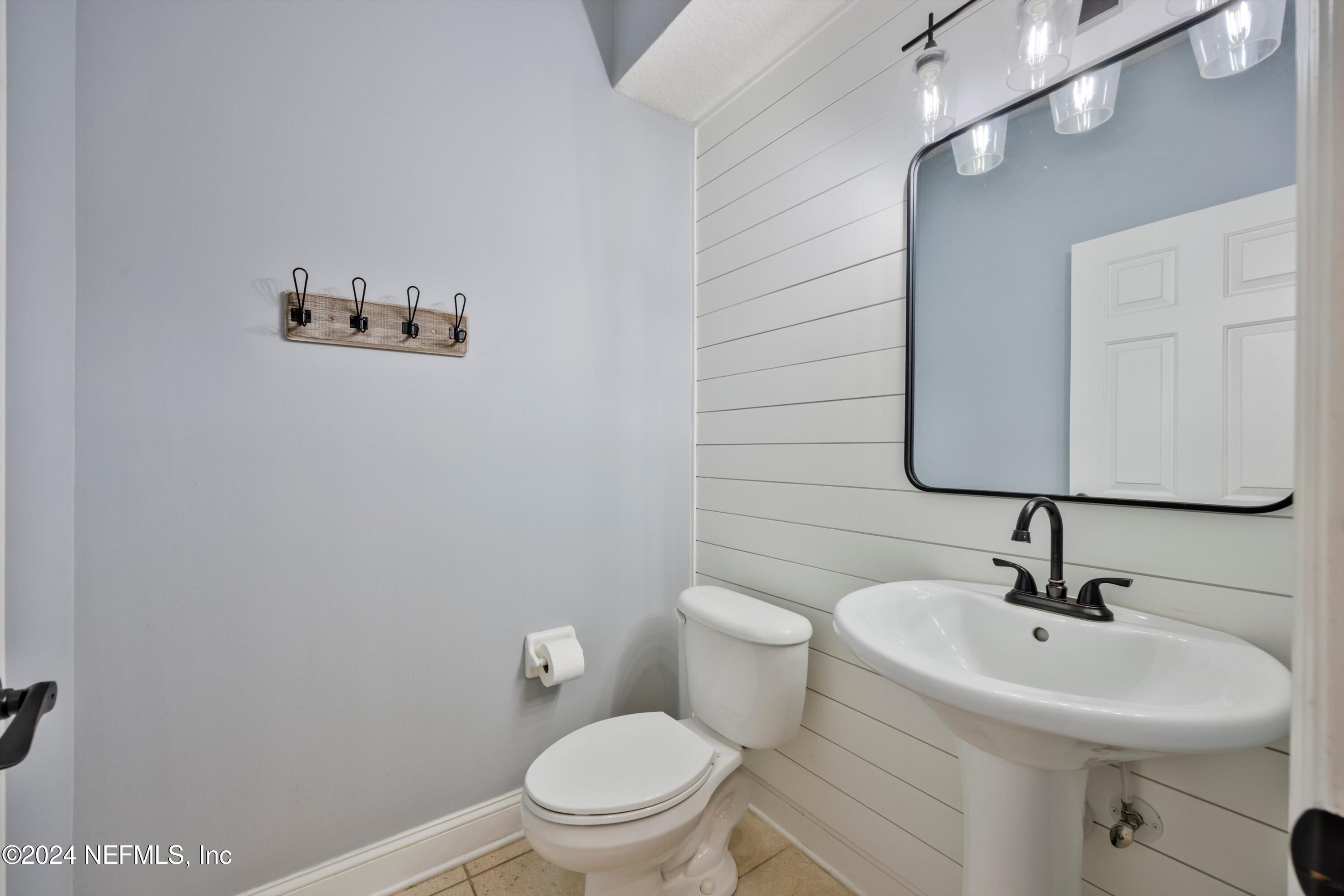 1843 South Landguard Road St. Augustine, FL 32092 - Photo 32 of 67 a bathroom with a sink mirror and toilet