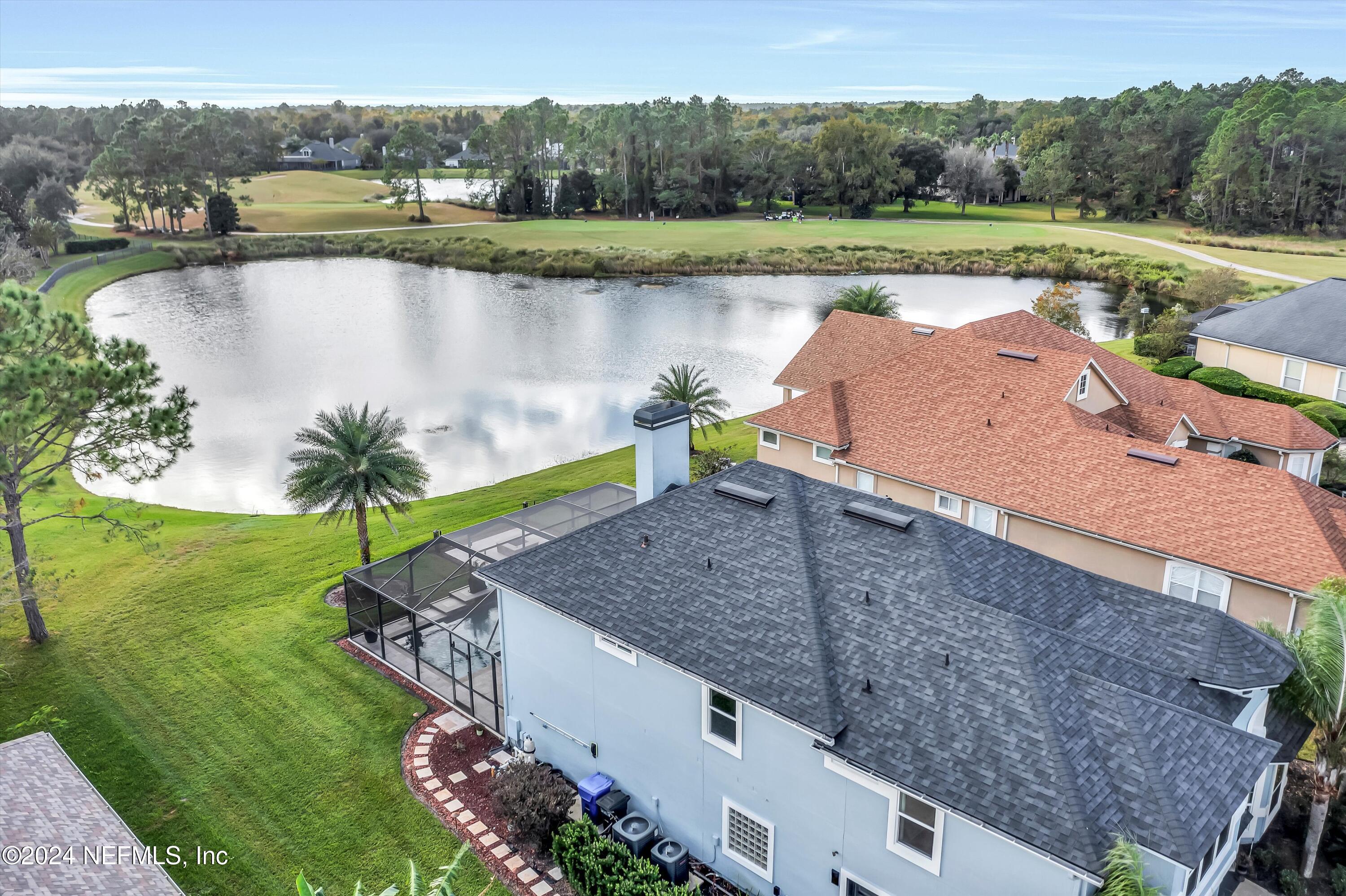 1843 South Landguard Road St. Augustine, FL 32092 - Photo 35 of 67 an aerial view of a house with a yard and lake view