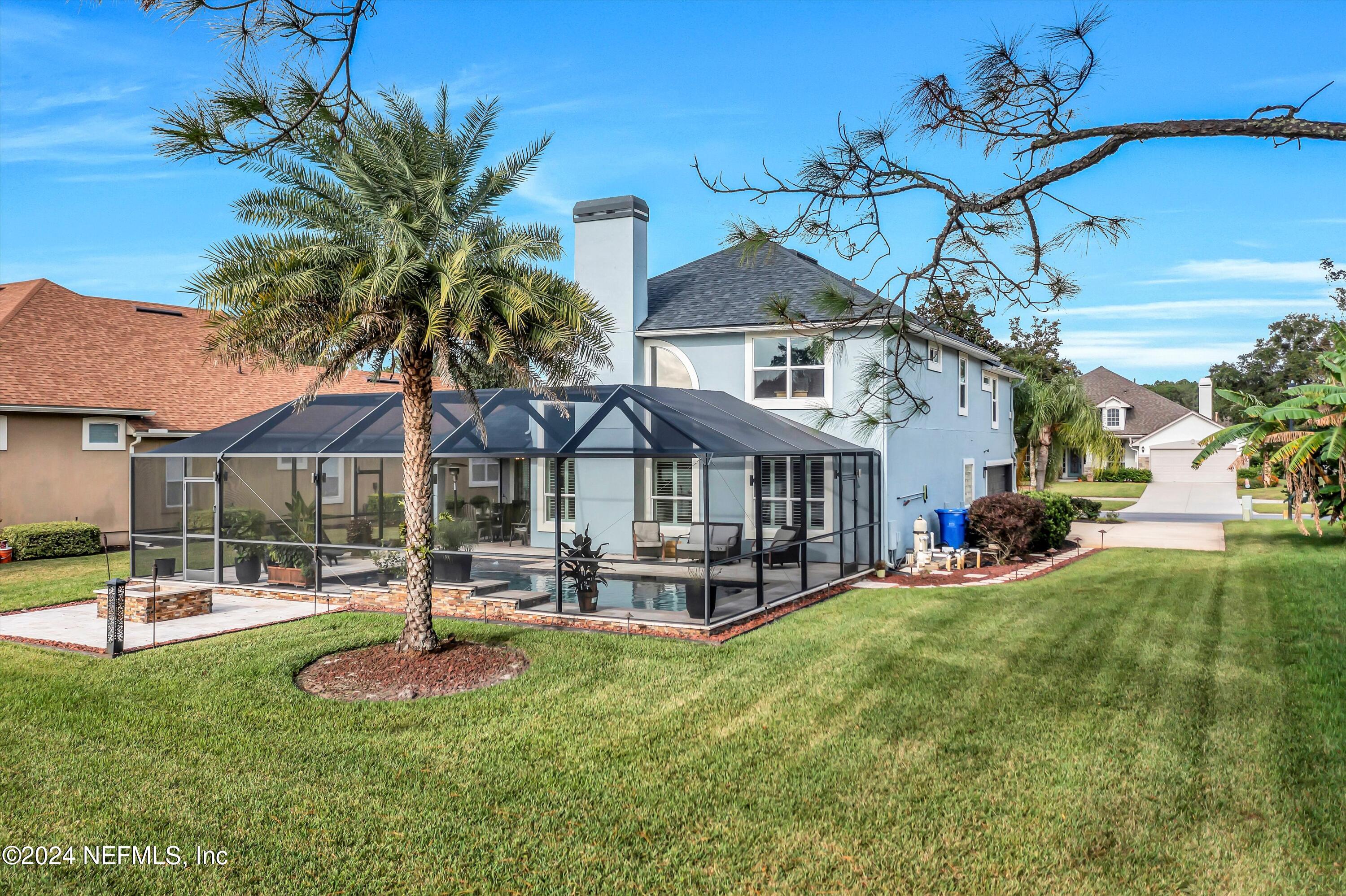 1843 South Landguard Road St. Augustine, FL 32092 - Photo 45 of 67 a front view of a house with garden and tree