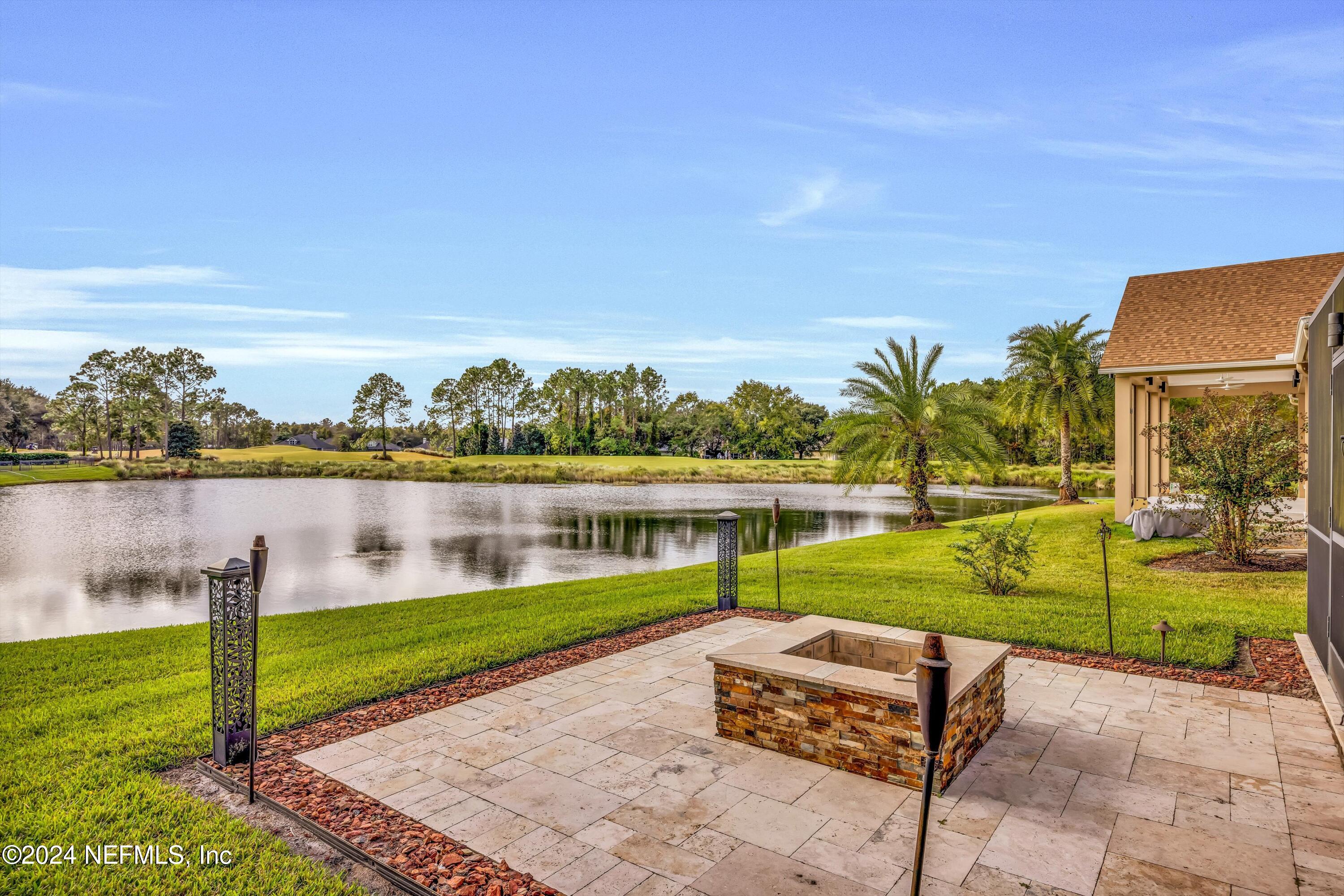 1843 South Landguard Road St. Augustine, FL 32092 - Photo 46 of 67 a view of a lake with a yard and large trees