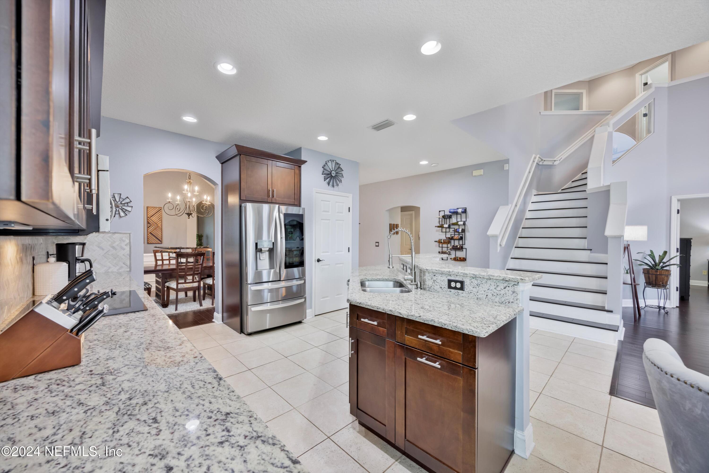 1843 South Landguard Road St. Augustine, FL 32092 - Photo 5 of 67 a kitchen with stainless steel appliances granite countertop a sink a stove and a refrigerator