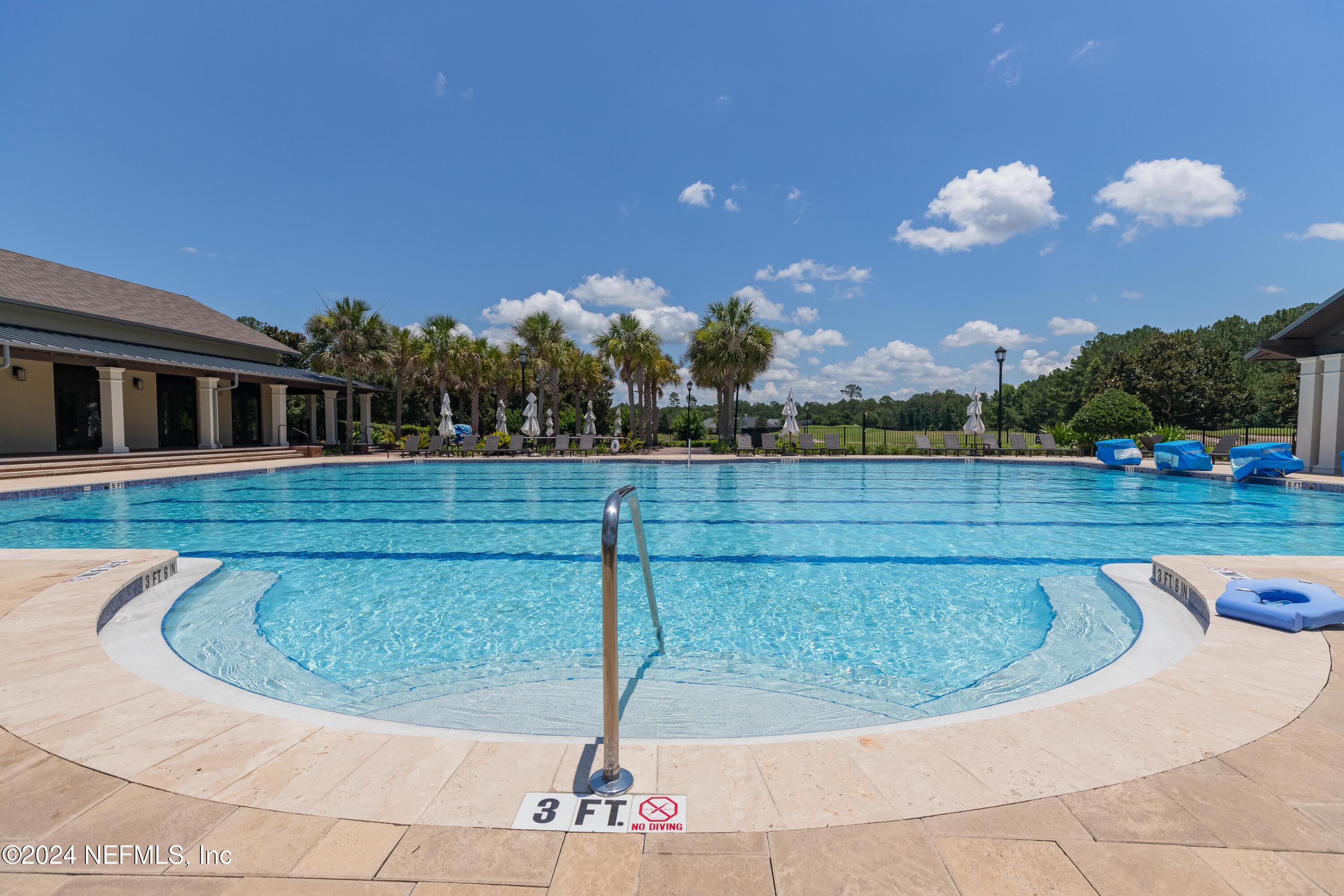 1843 South Landguard Road St. Augustine, FL 32092 - Photo 54 of 67 a view of a swimming pool with a yard