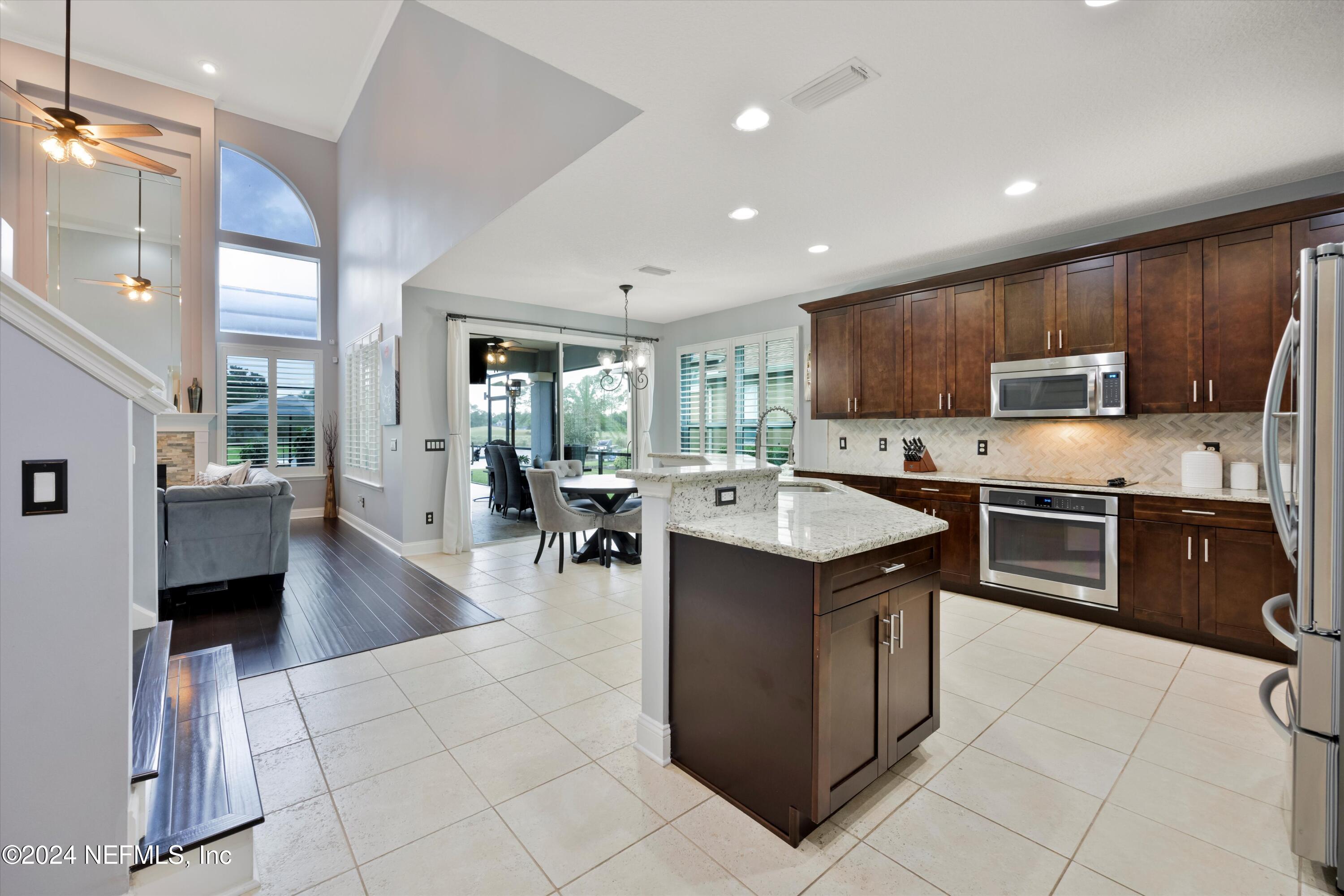 1843 South Landguard Road St. Augustine, FL 32092 - Photo 6 of 67 a kitchen with a sink stove and cabinets
