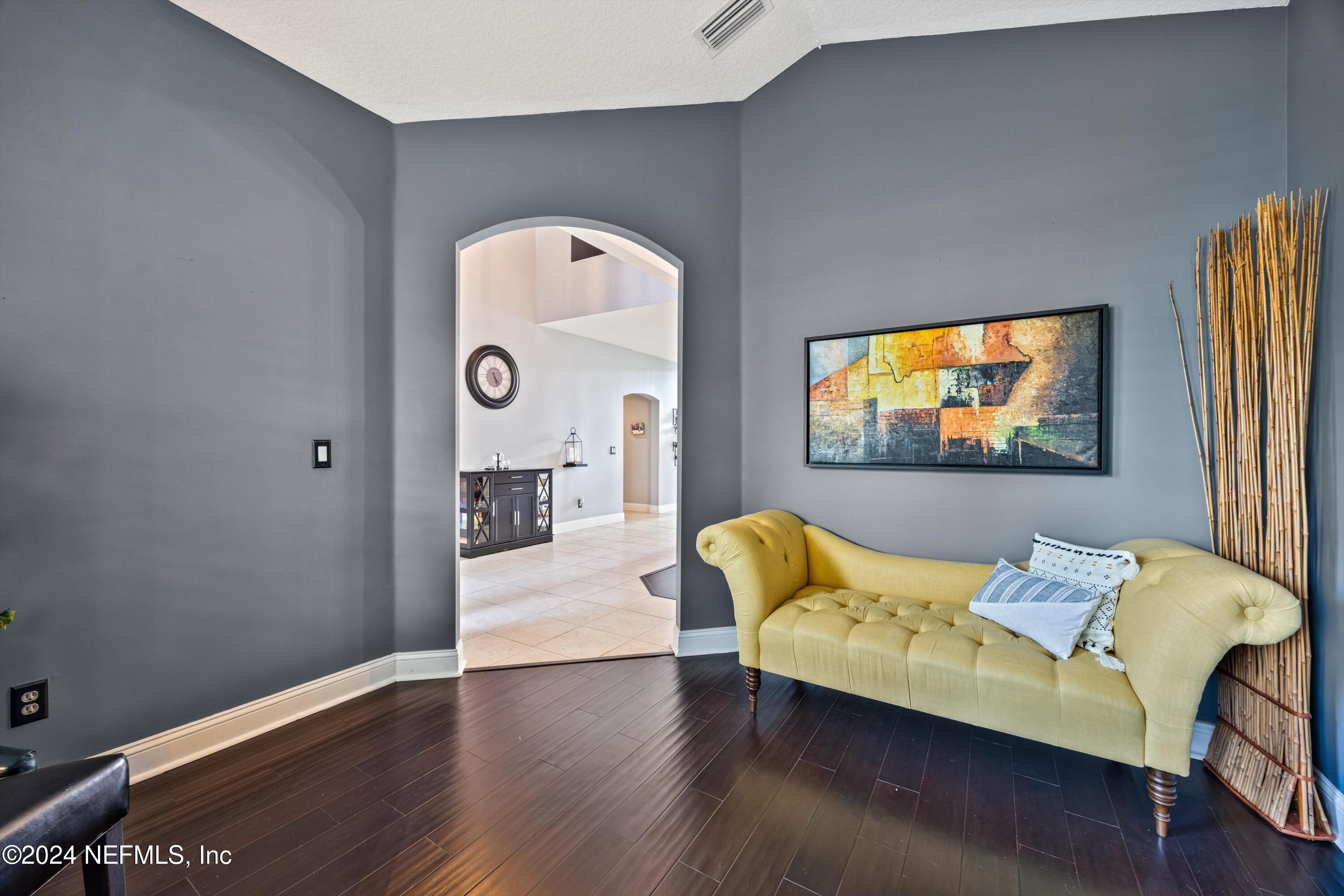 1843 South Landguard Road St. Augustine, FL 32092 - Photo 9 of 67 a living room with furniture and a flat screen tv