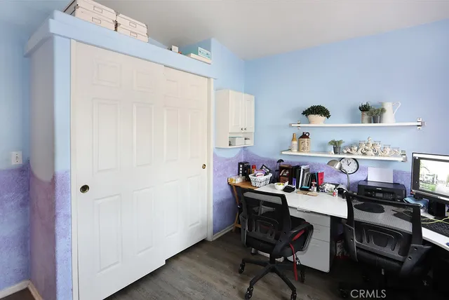 a dining room with furniture and a window