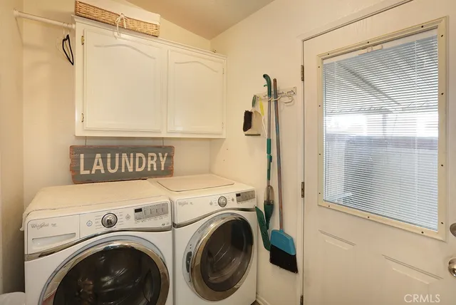 a view of bathroom with washer and dryer