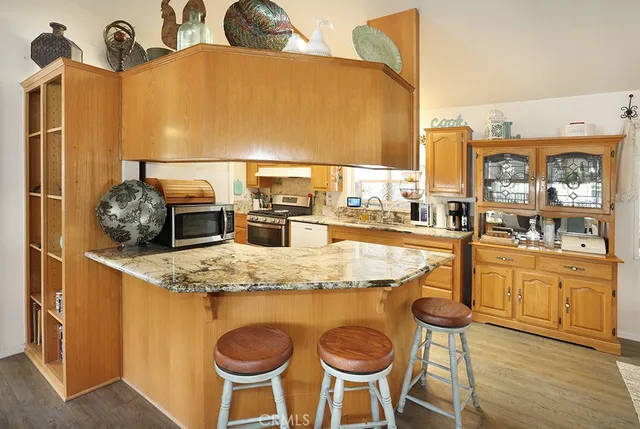 a kitchen with dining table and chairs