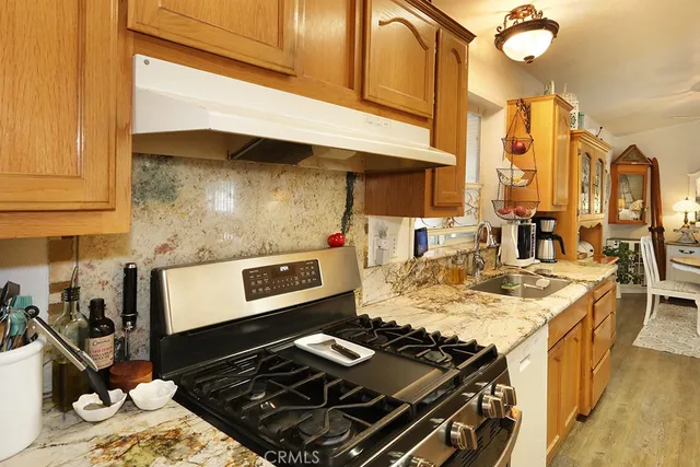 a kitchen stove sitting inside of a kitchen