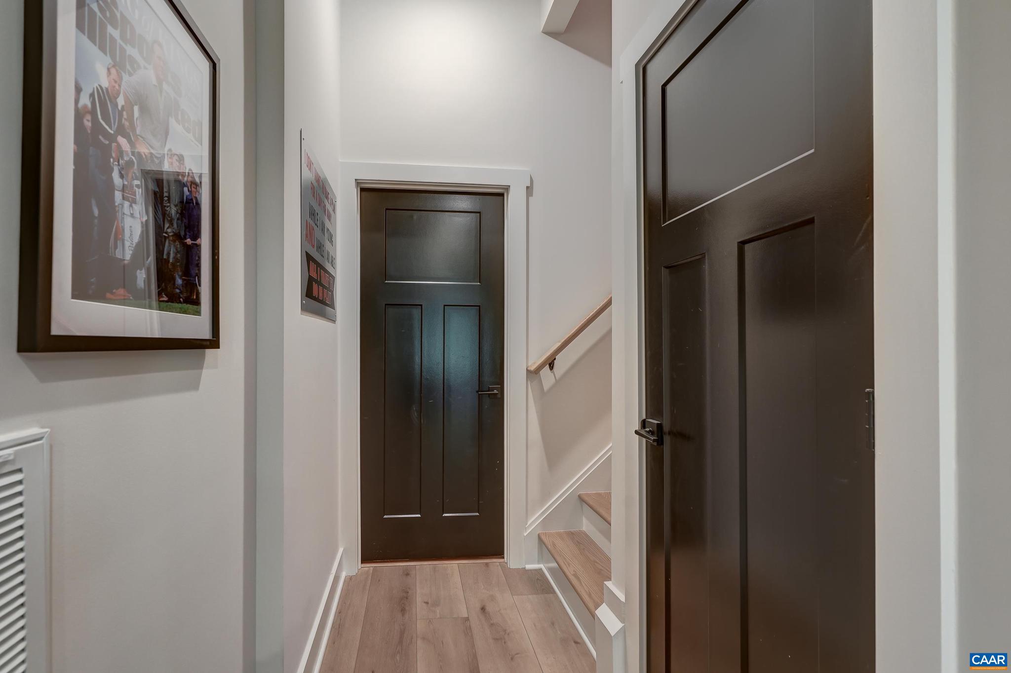 3327 Rowcross Street Crozet, VA 22932 - Photo 51 of 63 a view of a hallway with wooden floor and staircase