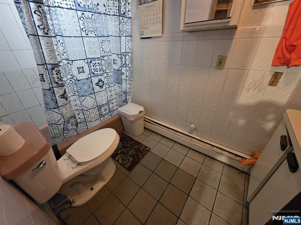 32 Elm Street Paterson, NJ 07501 - Photo 14 of 20 a bathroom with a toilet and a shower