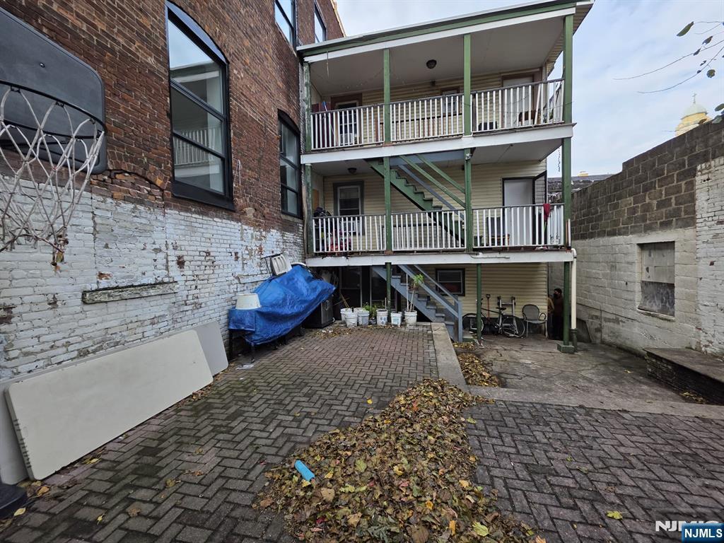 32 Elm Street Paterson, NJ 07501 - Photo 2 of 20 a view of a lounge chairs on the roof