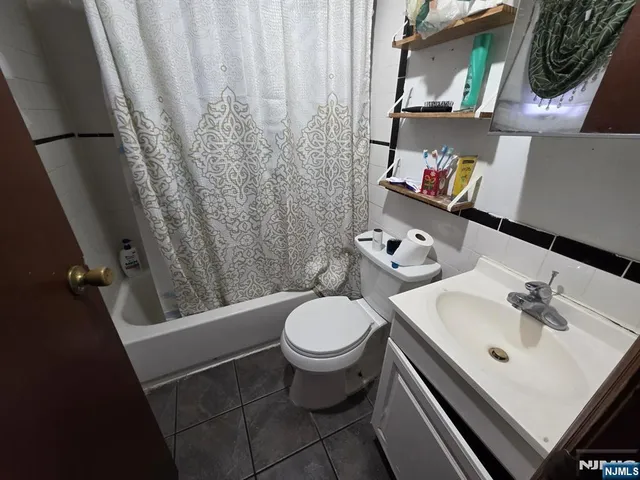 a white toilet sitting next to a bathroom sink