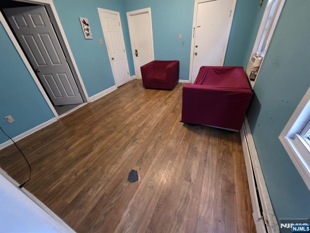 32 Elm Street Paterson, NJ 07501 - Photo 9 of 20 a living room with furniture and a wooden floor