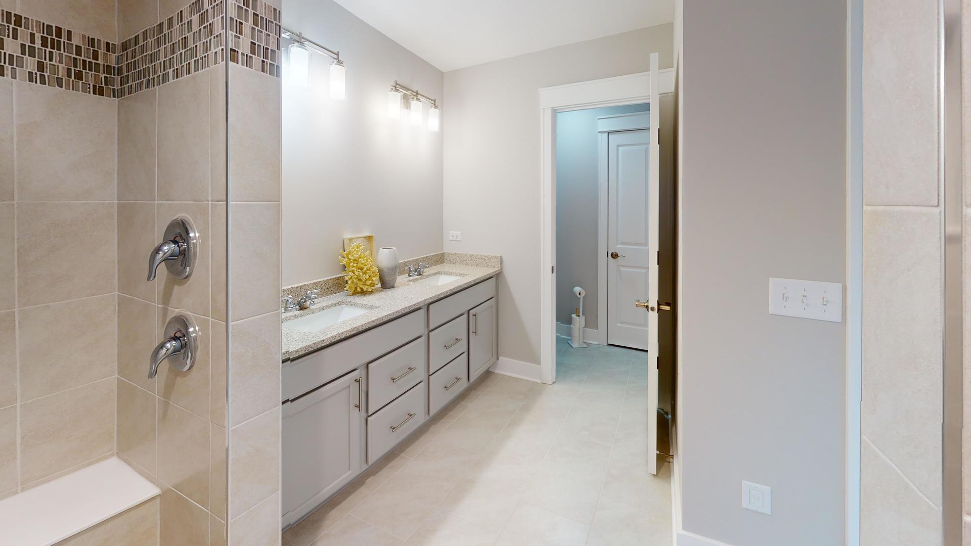 2 Deerpath Road North Aurora, IL 60542 - Photo 30 of 45 a bathroom with a double vanity sink and a mirror