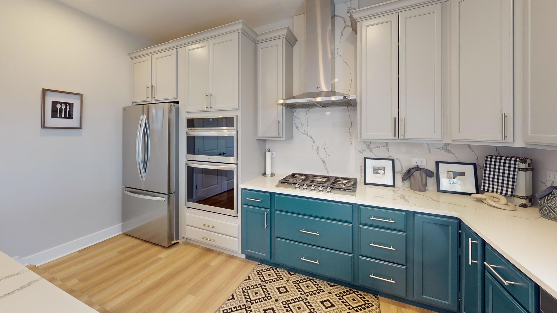 2 Deerpath Road North Aurora, IL 60542 - Photo 3 of 45 a kitchen with a refrigerator and a sink