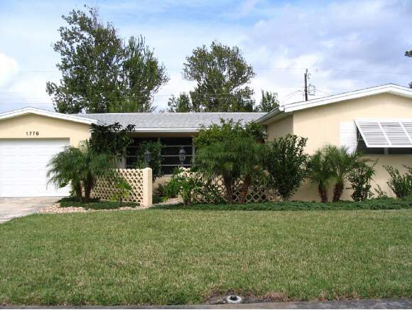 1776 North Dodge Melbourne, FL 32935 - Photo 1 of 6 a view of a house with a yard