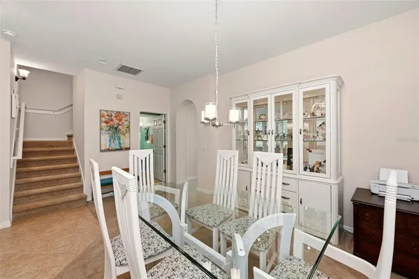 a view of a livingroom with wooden furniture and windows