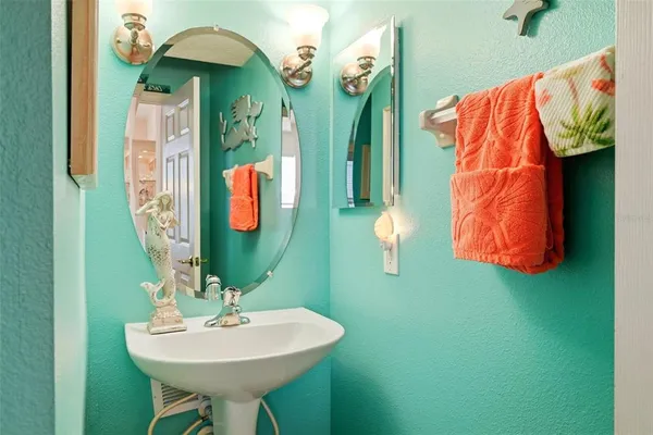 a bedroom with a bed and dresser with mirror