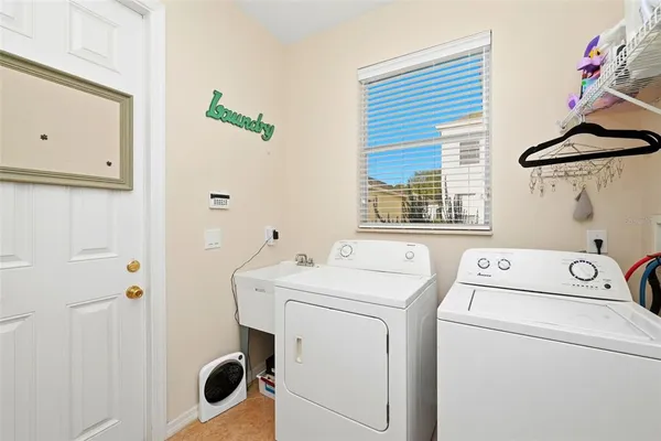 a red chair sitting in front of a window