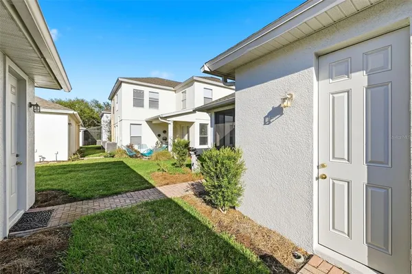 a front view of a house with a yard and porch