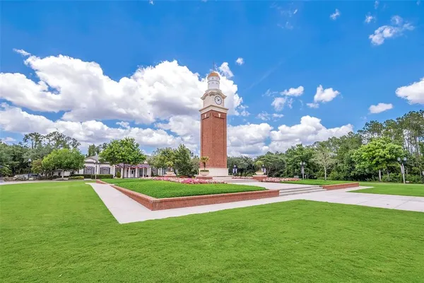 a view of yard with swimming pool and green space
