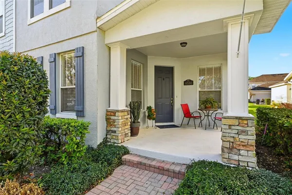 front view of a house with outdoor seating
