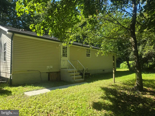 a backyard of a house with lots of green space