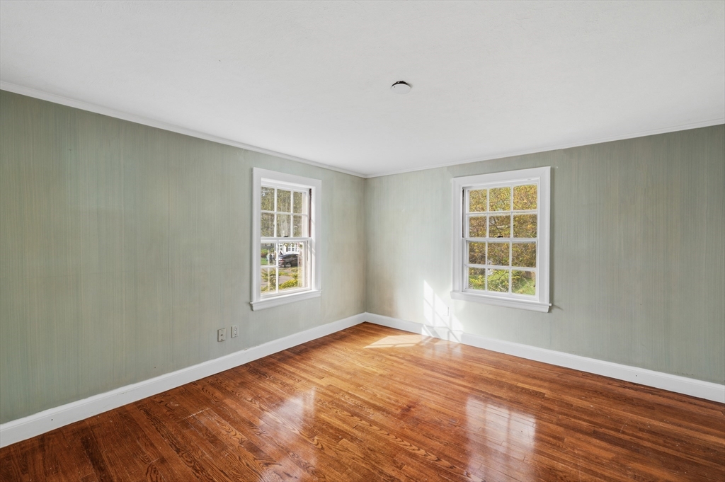 26 Pickwick Road Marblehead, MA 01945 - Photo 23 of 40 a view of an empty room with wooden floor and a window