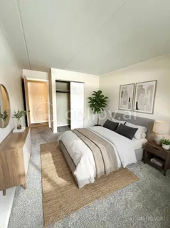 a spacious bedroom with a large bed and a couch
