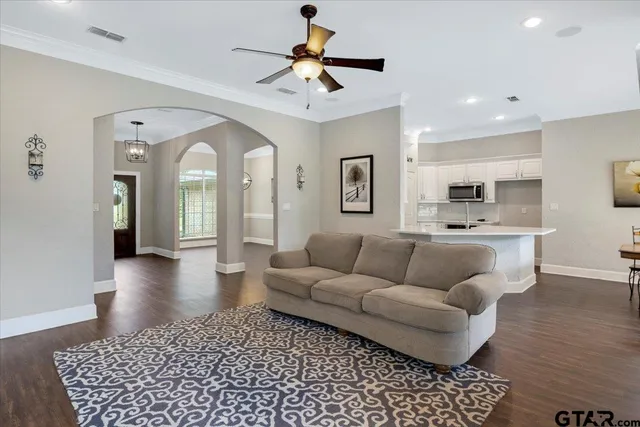 a living room with furniture and a rug