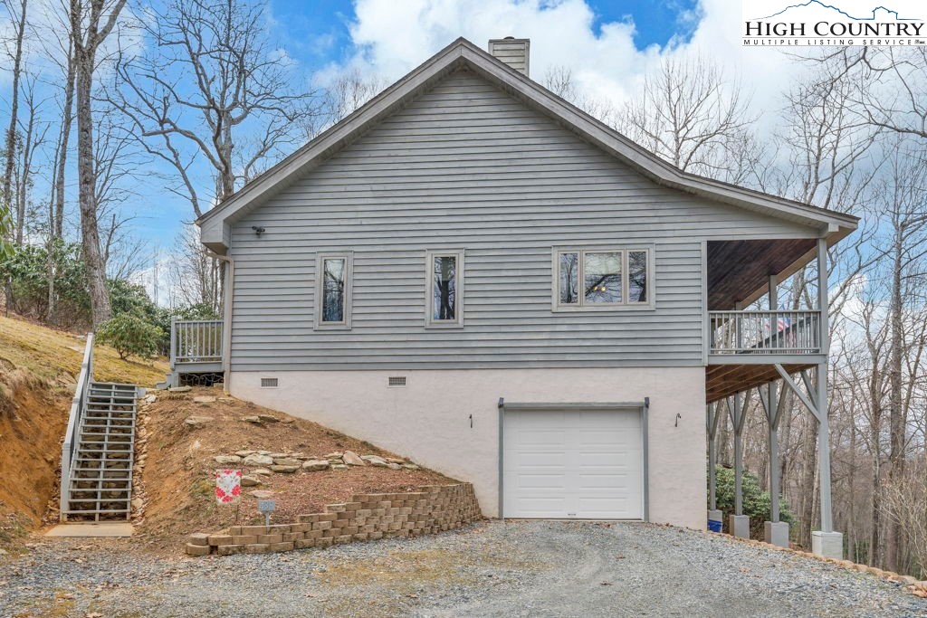 438 Virgil's Lane Boone, NC 28607 - Photo 3 of 32 a view of a house with a yard