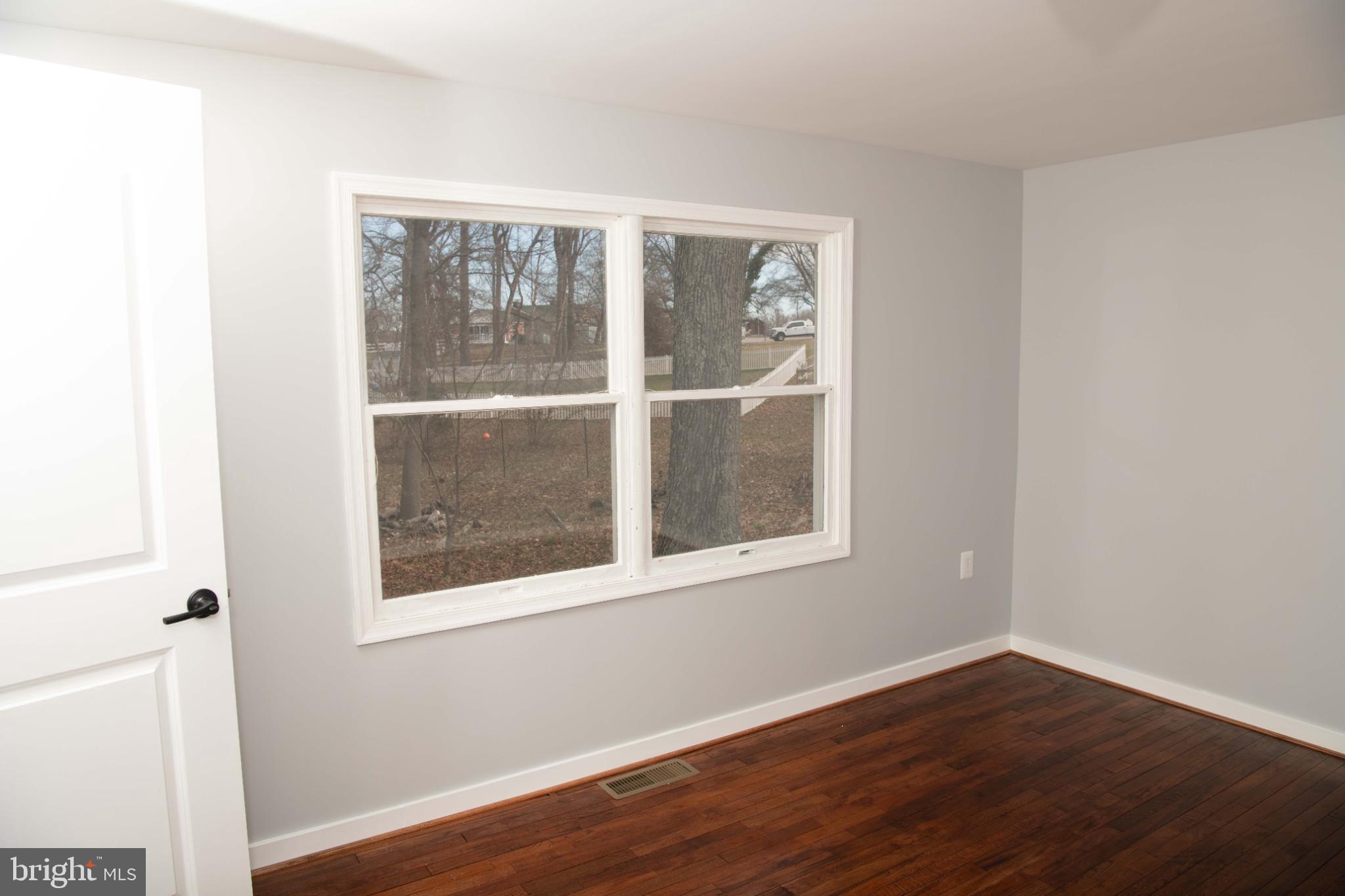 4785 Mountain Road Pasadena, MD 21122 - Photo 26 of 50 Bright airy bedroom #2 with scenic wooded views.