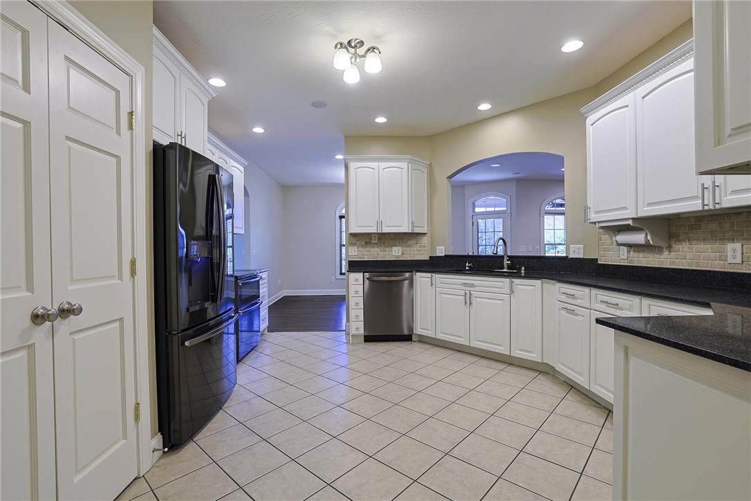 3681 Wilmington Road Lebanon, OH 45036 - Photo 14 of 87 This spacious kitchen offers ample cabinetry, modern appliances, and a seamless flow into adjacent living areas.