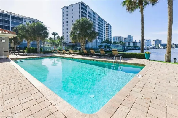 a view of a swimming pool with a lounge chairs