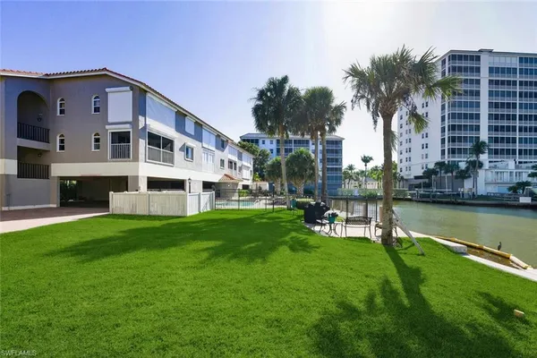 a view of a garden with lawn chairs