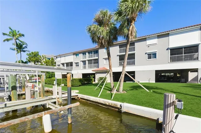 a house with swimming pool in front of it