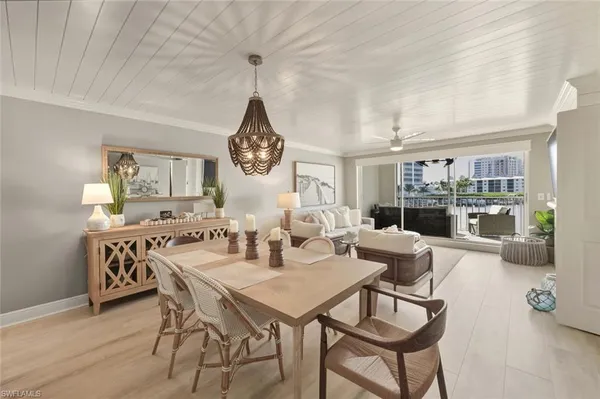 a large kitchen with a table and chairs