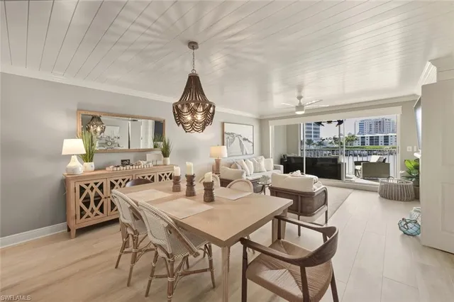 a large kitchen with a table and chairs