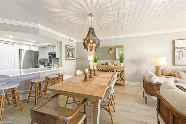 a view of a dining room with furniture and window