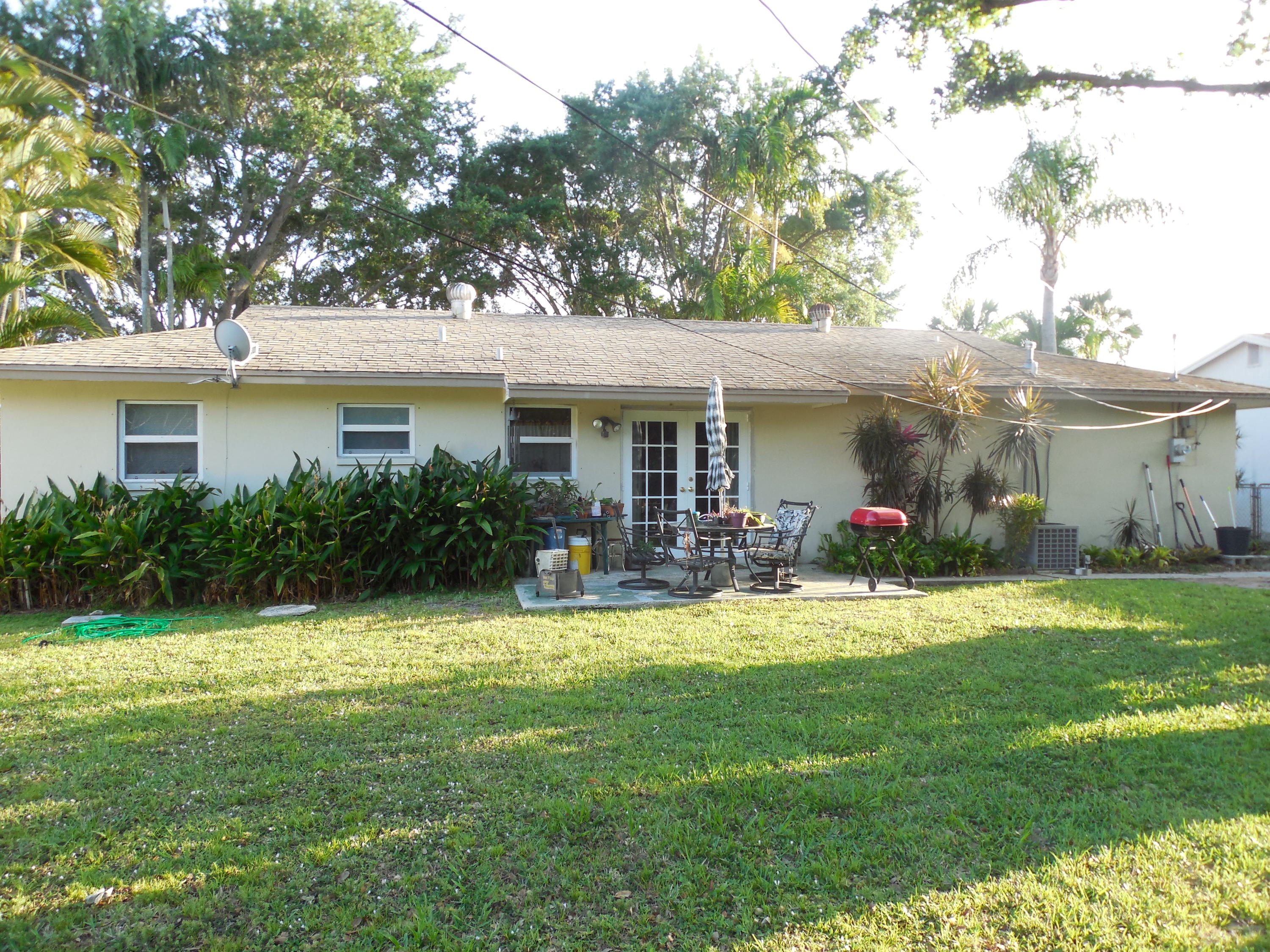 3329 Grove Road Palm Beach Gardens, FL 33410 - Photo 17 of 28 Back of the beautiful home