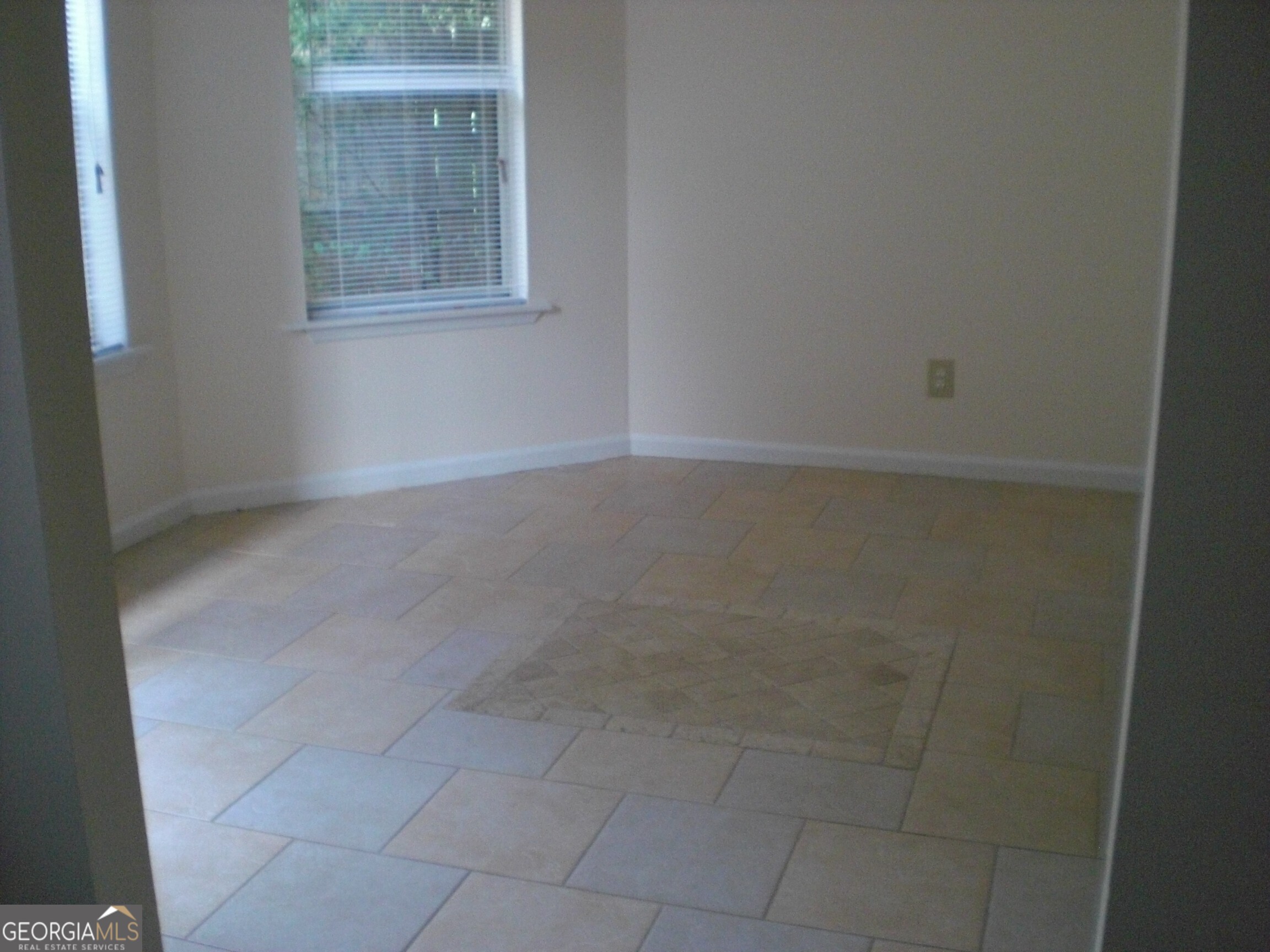 1651 Rolling Hills Trail Southeast Conyers, GA 30094 - Photo 3 of 5 a room that has a window in it