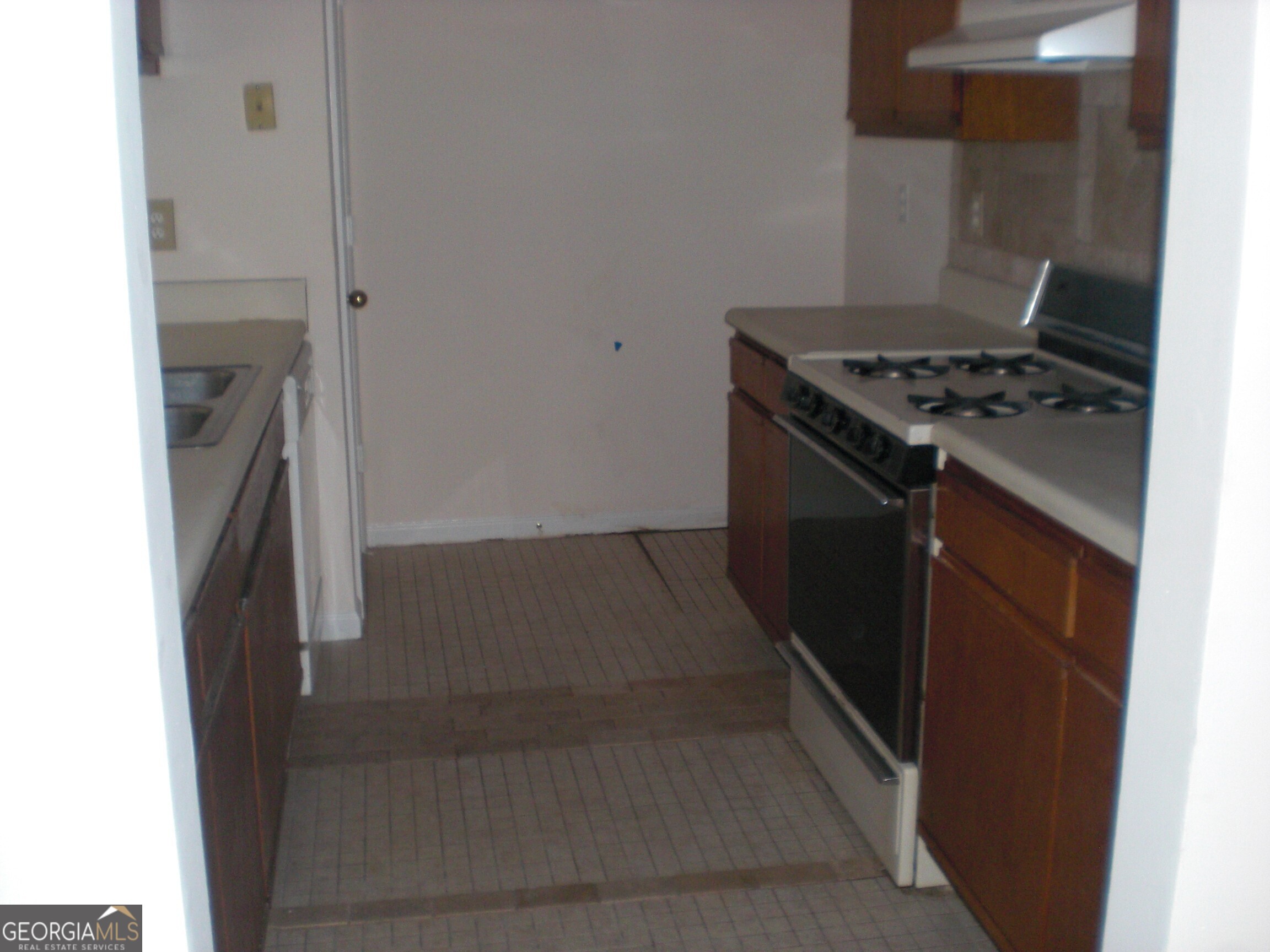 1651 Rolling Hills Trail Southeast Conyers, GA 30094 - Photo 4 of 5 a kitchen with a stove