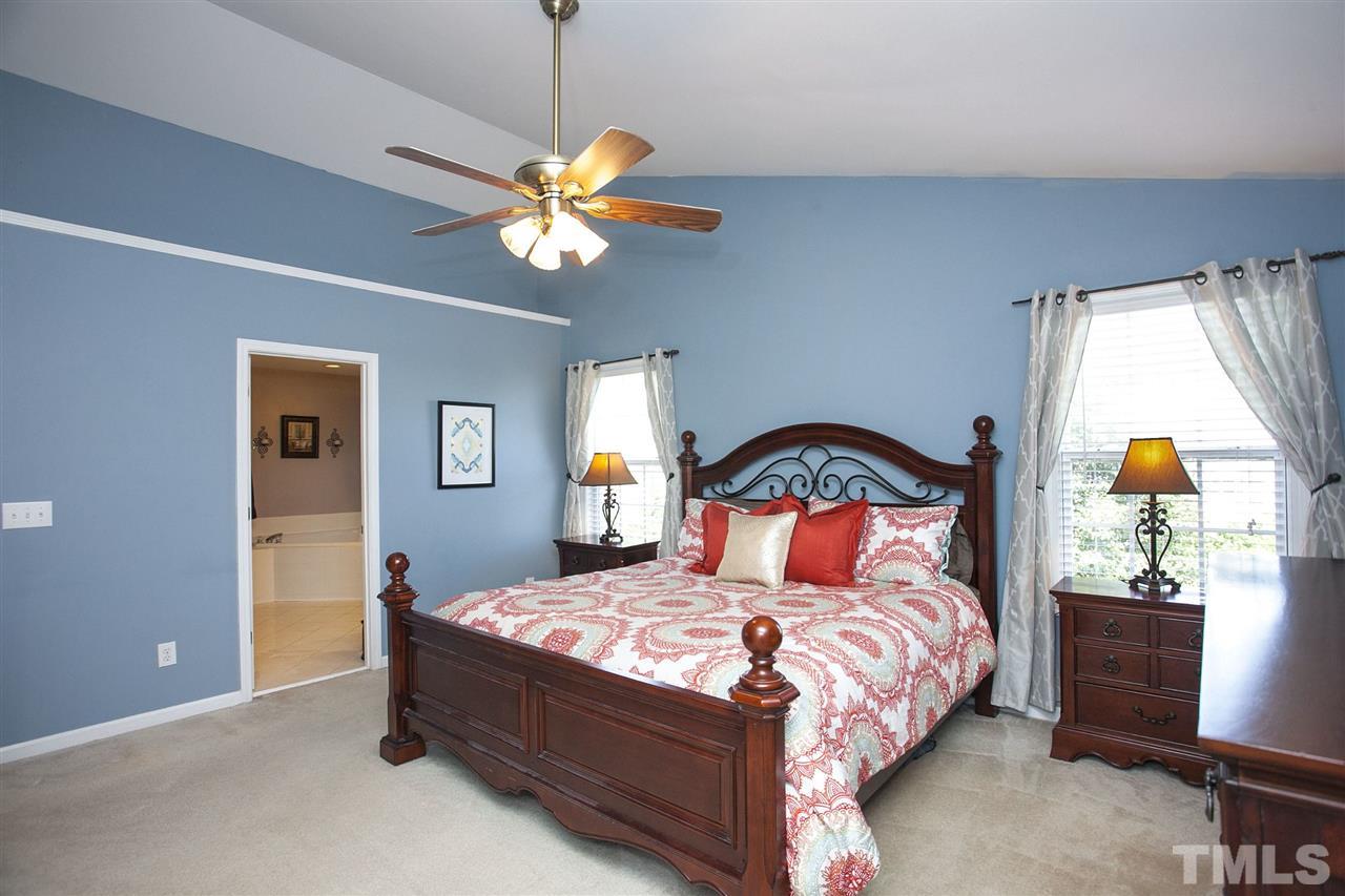 308 Inkster Cove Raleigh, NC 27603 - Photo 11 of 25 a bedroom with a bed and window