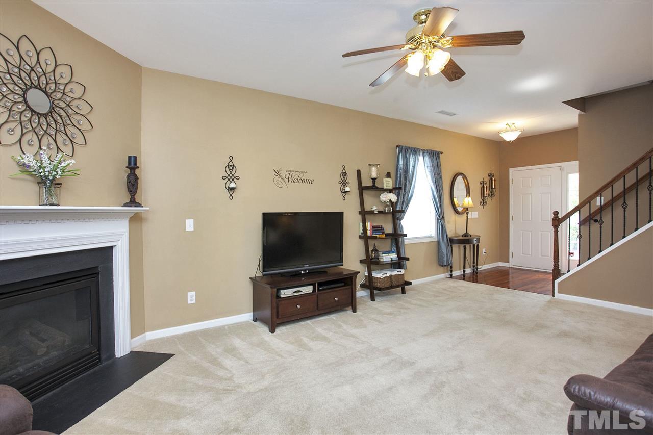 308 Inkster Cove Raleigh, NC 27603 - Photo 5 of 25 a living room with furniture and a flat screen tv