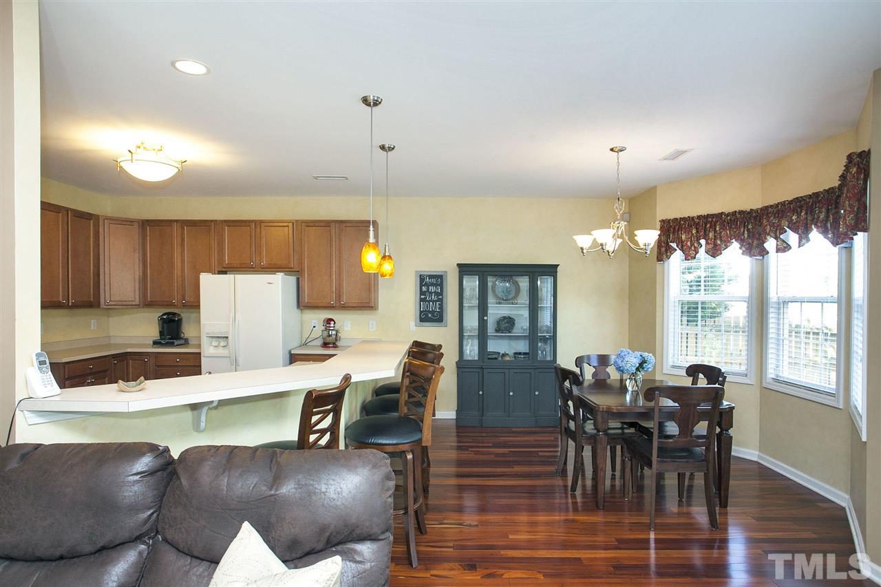 308 Inkster Cove Raleigh, NC 27603 - Photo 6 of 25 a view of a dining room with furniture window and outside view
