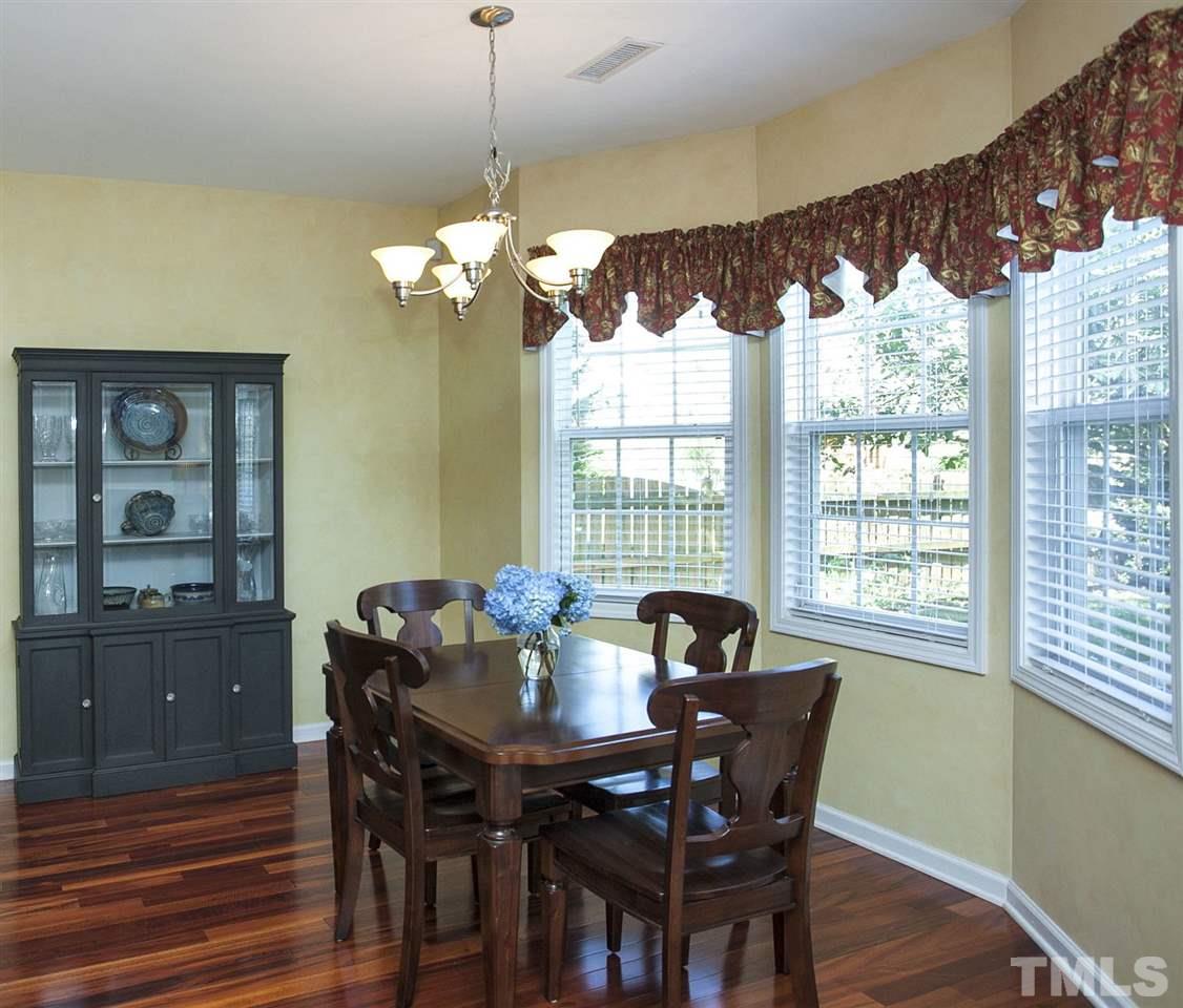 308 Inkster Cove Raleigh, NC 27603 - Photo 10 of 25 a view of a dining room with furniture window and outside view