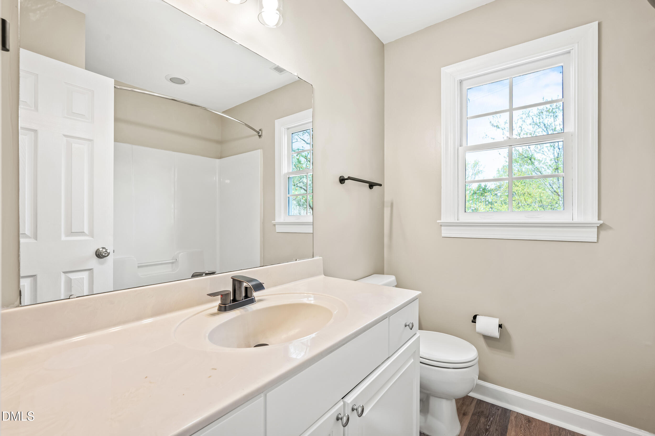 1957 Hilltop Road Raleigh, NC 27610 - Photo 28 of 46 a bathroom with a sink a toilet and a tub